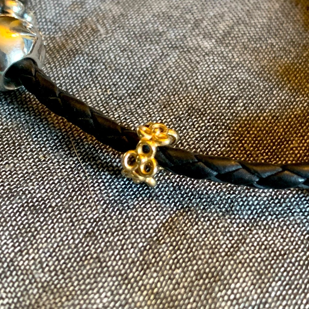 Pandora retired solid gold trinity flower spacer.